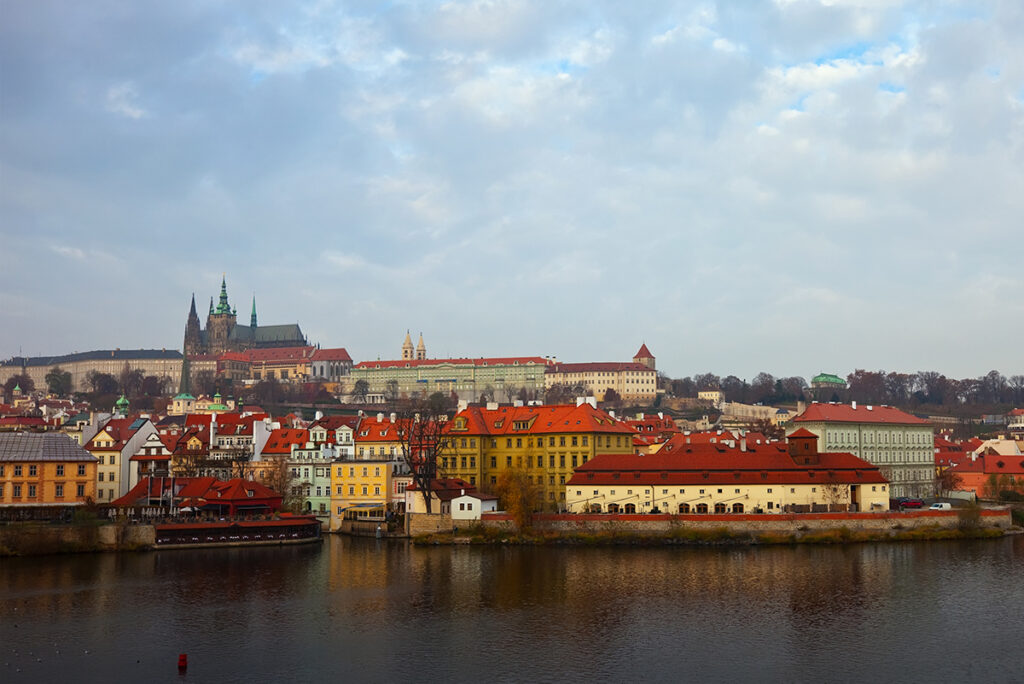 The charming medieval town of Český Krumlov in the Czech Republic, with its colorful buildings along the Vltava River and the majestic Český Krumlov Castle above.